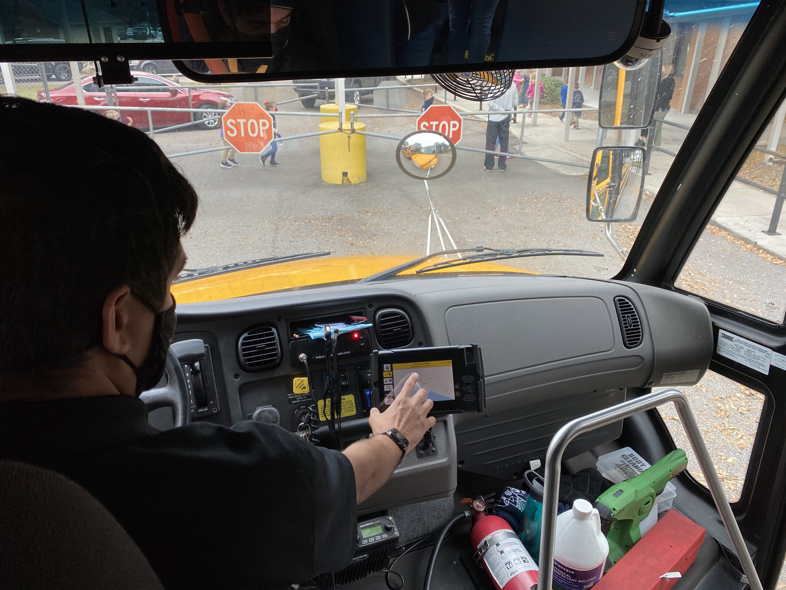 School Bus Driver with ID Card Tablet reader